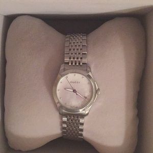 Gucci mother of pearl watch.